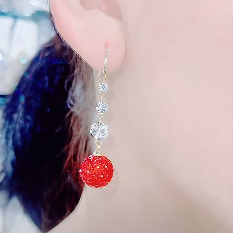 Boucles d'oreilles élégantes longues boules rouges pleines de diamants